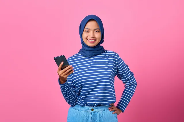girl, smartphone, happy, portrait, smile, joyful, cellphone, teenager, hijab, charm, cheerful, mobile phone, online, phone, confidence, attractive, model, pose, asian, pink background, girl, smartphone, teenager, teenager, teenager, teenager, hijab, hijab, hijab, hijab, hijab, mobile phone, online, online, phone, confidence, confidence, pink background. Where is Gen Z brand loyalty heading, and why does it keep shifting?