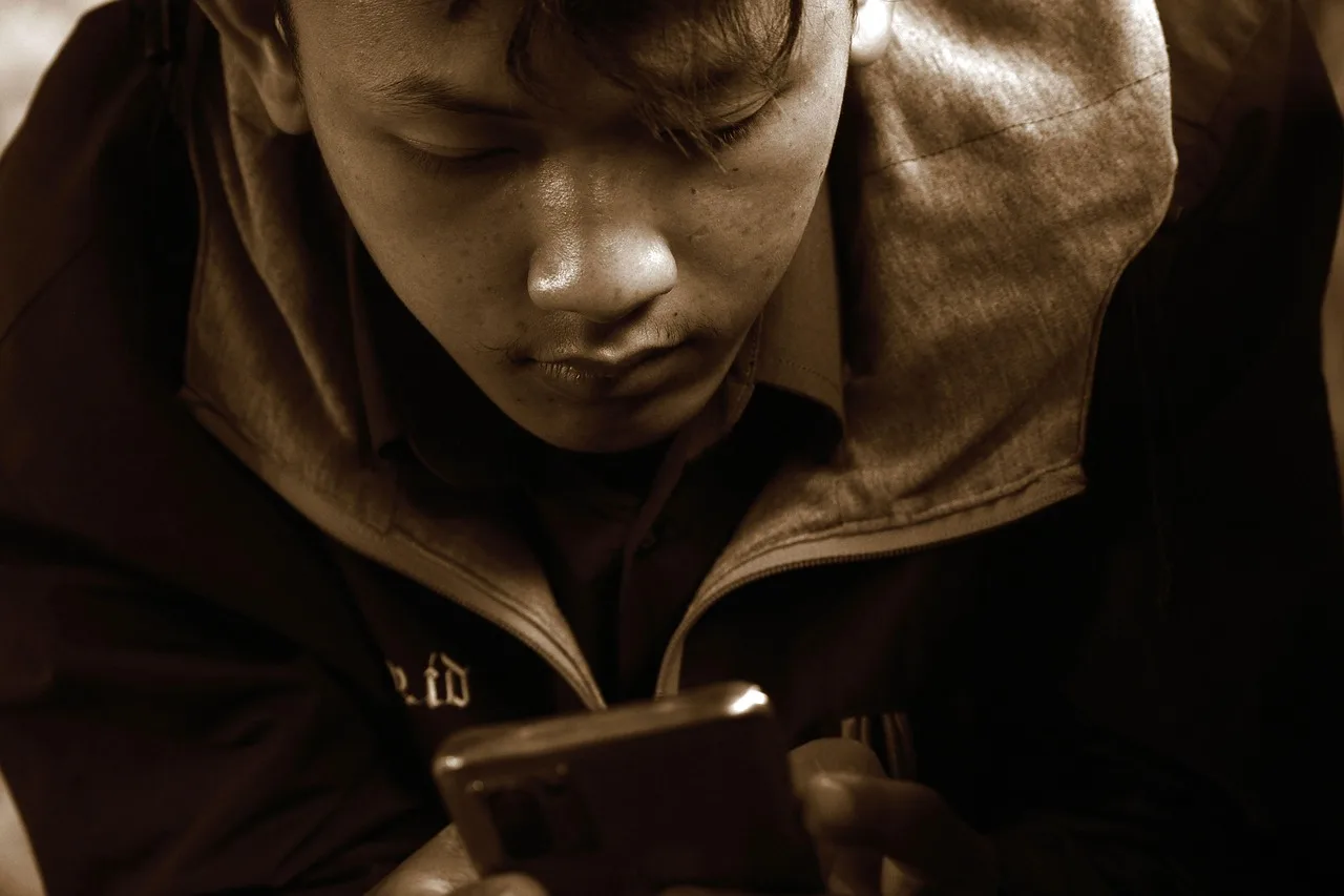 communication, smartphone, mobile phone, young man, lifestyle. Why is Gen Z consumer behavior shifting so quickly this year?