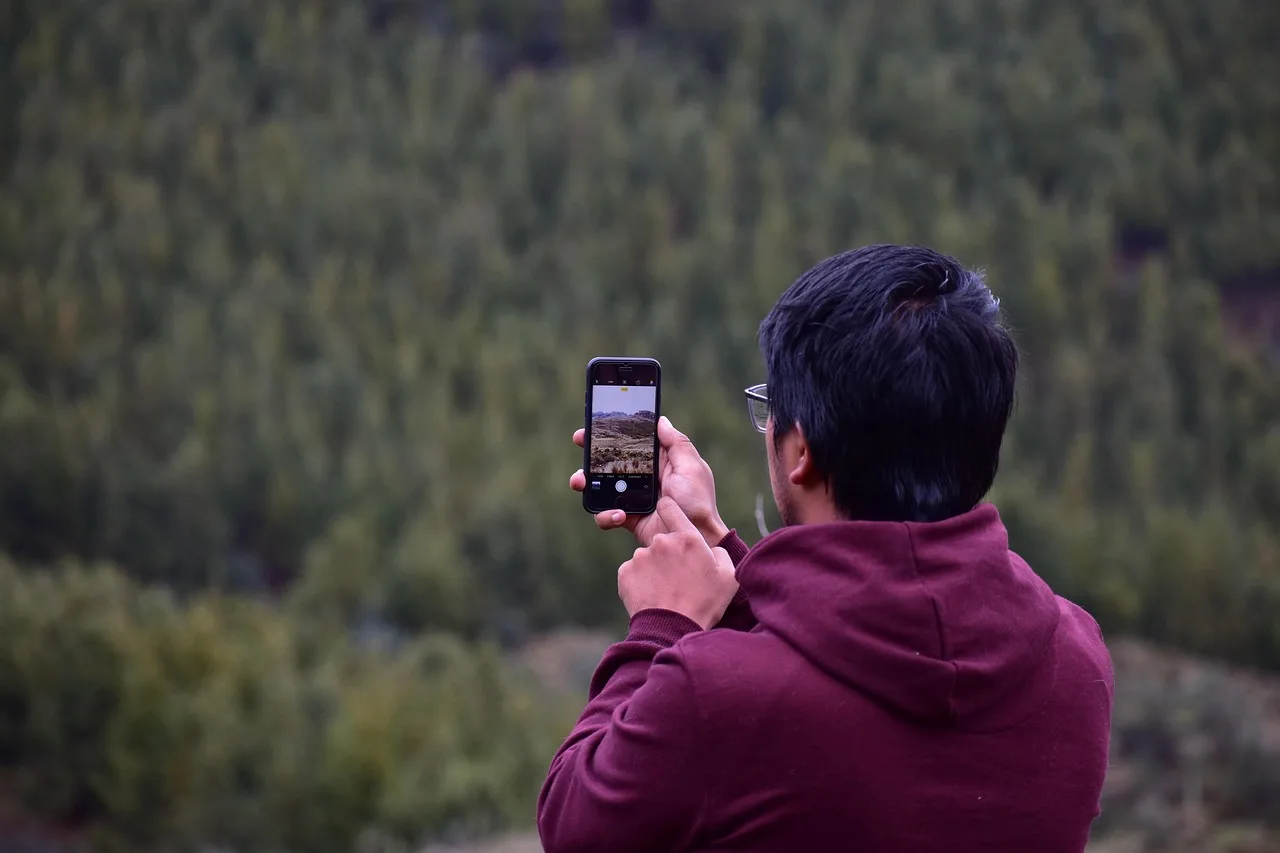 young guy, cellular, taking photo, smartphone, camera. Gen z marketing strategy: the choices that shape everything else