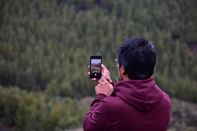 young guy, cellular, taking photo, smartphone, camera. Gen z marketing strategy: the choices that shape everything else